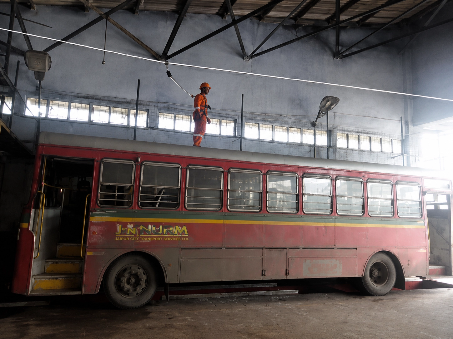 Overhead line for vehicle maintenance bay